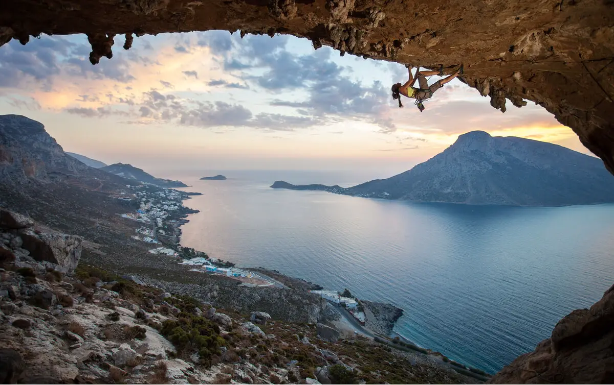 Rock climber on a wall on Kalymnos Island - adventure travel in Greece