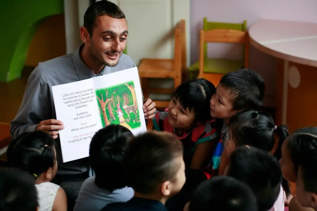 A working traveller teaching English to kids