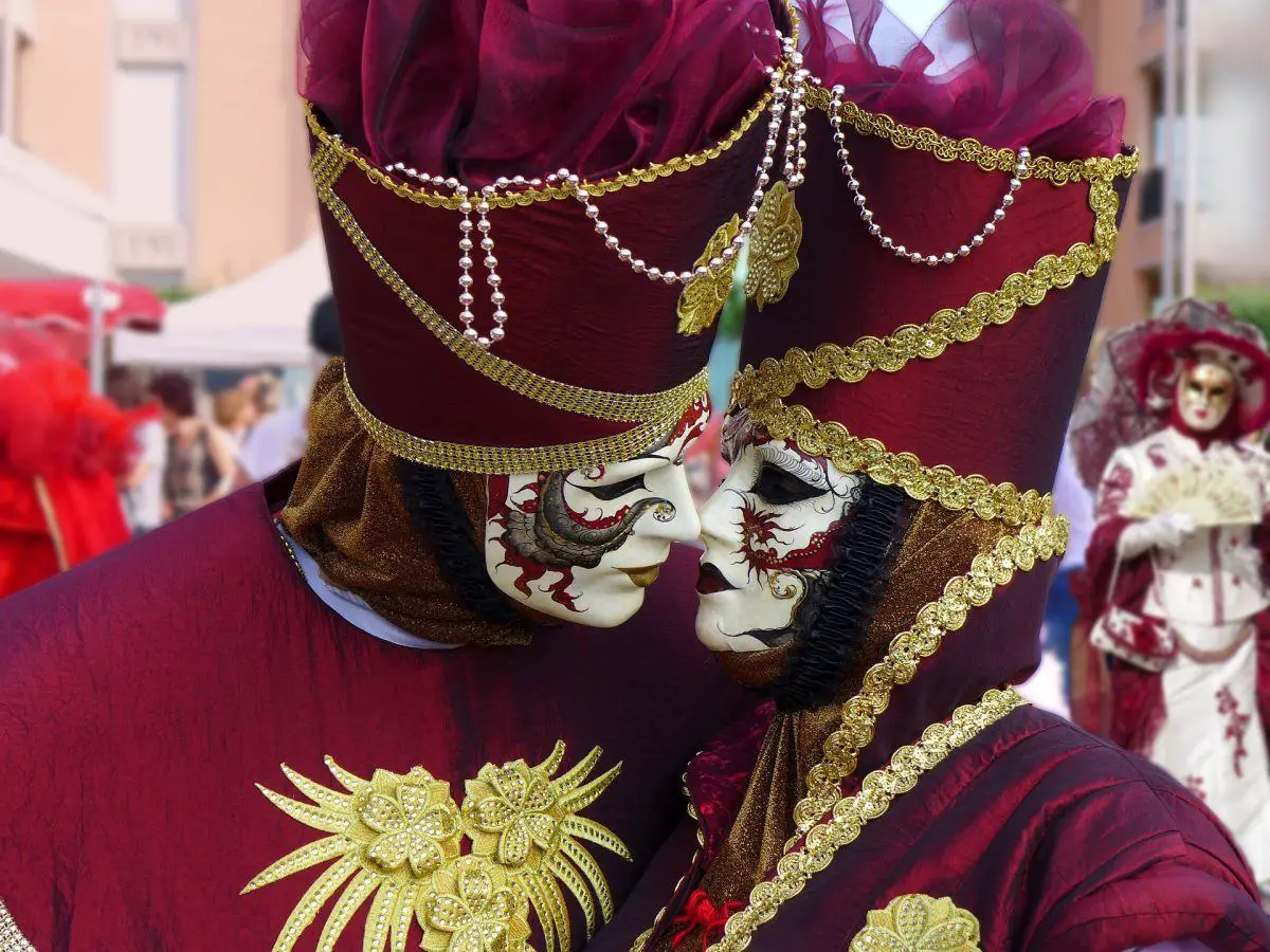 masked celebrators attending carnevale in venice italy