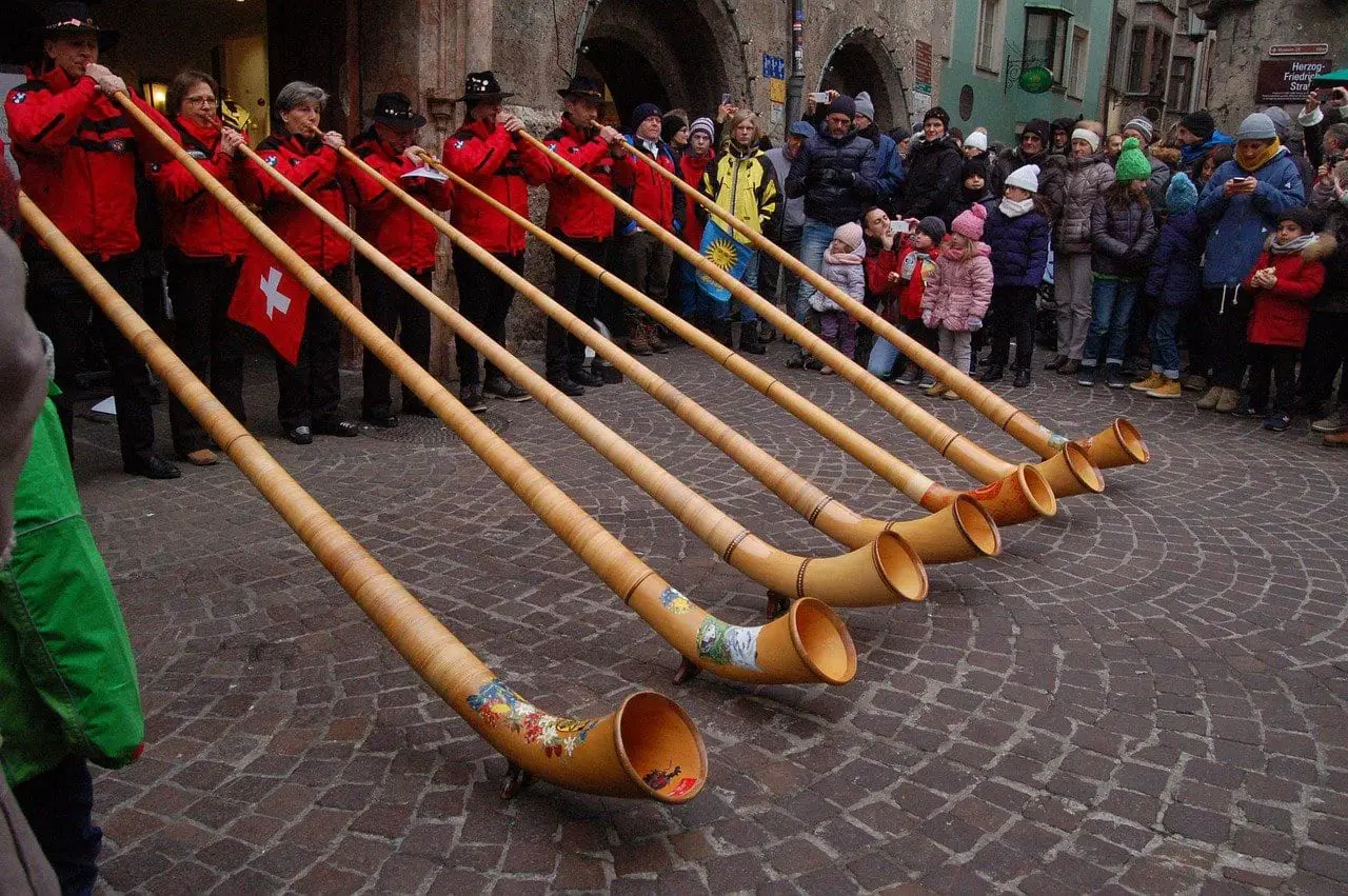swiss culture people blowing horn