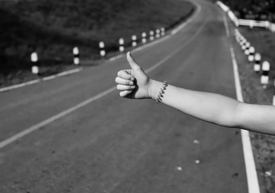 A woman's hand hitchhiking in Greece