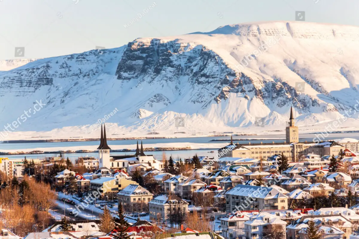 Reykjavik with snowy mountains rising behind