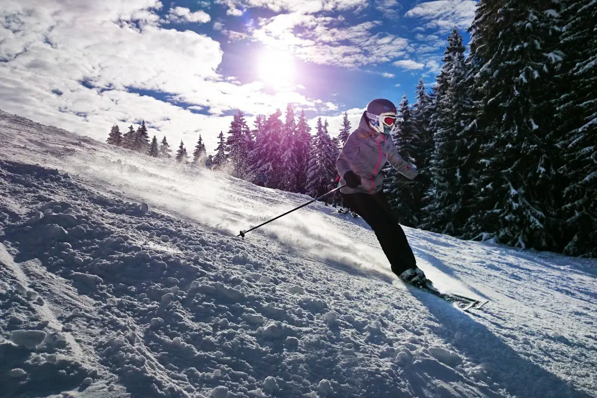 A person skiing down a mountain in banf canada