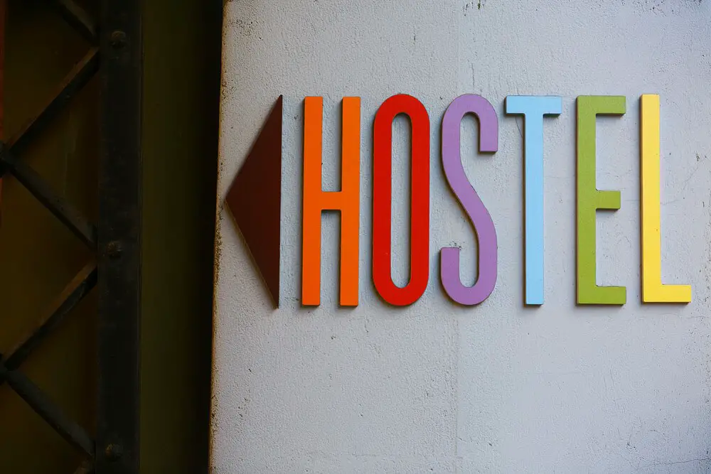 A rainbow coloured sign for a very safe hostel